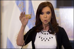 Argentine President Cristina Fernandez gives a speech, aired on national TV, during an event at the Casa Rosada government palace in Buenos Aires, Argentina.