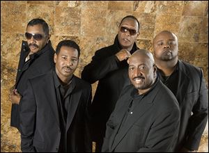  The Temptations are lead by founding member Otis Williams, front.