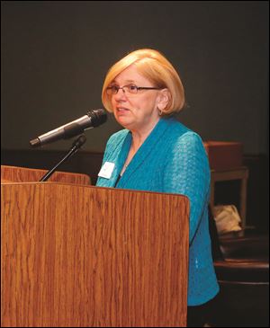 Gini Steinke, President of Ovarian Cancer Connection, speaks during the survivor luncheon. 