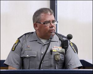Ohio Highway Patrol Trooper Charles G. Grizzard testifies that Lori Massingill was ‘‍distraught’ and ‘‍hysterical’ after the automobile crash that killed her twins, Presley and Parker, in November.
