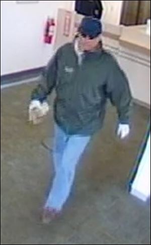 An image of the suspect from a surveillance camera at the Lewis Avenue PNC bank which was robbed early today.