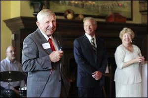 Dick Anderson, left,  says a few words during the reception for the Toledo Symphony held at the Inverness Club in Toledo.