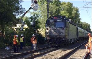 An Amtrak train struck a vehicle overnight in Mansfield, Mass. Three people in the vehicle were killed. Service on Amtrak and MBTA lines was delayed while the crash was investigated. 