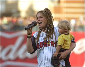 American Idol contestant Crystal Bowersox sang the national anthem with her son, Tony, in 2010.