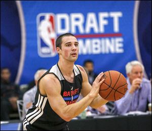 Aaron Craft from Ohio State participates in the 2014 NBA basketball Draft Combine in May. Craft today signed a training camp contract with the Golden State Warriors.