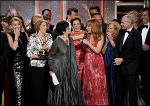 The crew of The Young and the Restless accepts the award for outstanding drama series at the 41st annual Daytime Emmy Awards at the Beverly Hilton Hotel on Sunday in Beverly Hills, Calif.