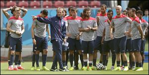 U.S. coach Jurgen Klinsmann, who is from Germany, instructs his players Wednesday. The Americans play Germany at noon today.