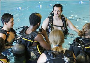 Aqua Hut instructor candidate Zech Hites instructs students on Wednesday at the Maritime Academy’s pool at 803 Water St.