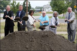  From left: Toledo-Lucas County Port Authority President Paul Toth, Jr., ODOT District II Deputy Director Todd Audet, City Council President Paula Hicks-Hudson, Mercy Healthcare Center's Steve Nathanson, City Council member Theresa Gabriel and Toledo Mayor D. Michael Collins break ground.