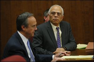 UTMC Dr. Nabil Ebraheim, 63, sits with his attorney Jerry Phillips during his bench trial before Judge Timothy Kuhlman in Toledo Municipal Court for vehicular manslaughter, a misdemeanor, alleging he caused the death of motorcyclist Lawrence J. Hilton, 54, of Swanton at Dorr and Richards.