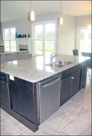 The kitchen island is extra wide, and every meal here will be created and enjoyed in comfort.