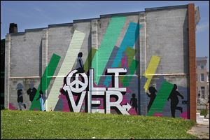 A mural by Operation Oliver adds a splash of art to a neighborhood once known for vacant homes, poverty, and crime. From 2002 to 2008, the Oliver neighborhood of Baltimore was the filming location for the gritty HBO drama ‘‍The Wire.’‍