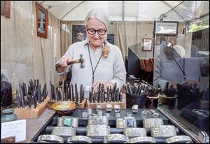 Sally Wade, of Sally Wade Works, uses a punch she created. By designing her own punches, the Tyler, Texas, woman says she can create ‘‍one-of-a-kind every-day jewelry.’ The Crosby show says it has more than 200 artists.