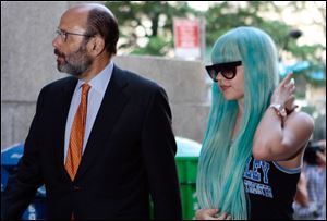 Amanda Bynes, accompanied by attorney Gerald Shargel, arrives for a court appearance in New York in July, 2013 on allegations that she chucked a marijuana bong out the window of her 36th-floor Manhattan apartment.