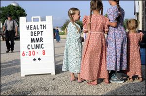 Young Mennonite girls gather at the health and safety clinic, which included a Measles, Mumps, & Rubella vaccinations in Shiloh, Ohio.
