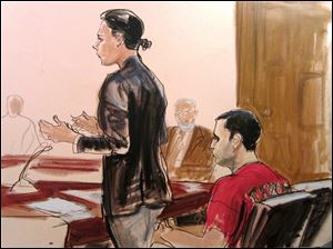 In this October, 2012, courtroom drawing, federal defender Julia Gatto requests bail for her client, New York City police Officer Gilberto Valle, right, at Manhattan Federal Court in New York.