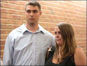 Anthony and Autumn Nelson, parents of Ian Nelson, stand outside a pretrial hearing Tuesday in Findlay Municipal Court for a misdemeanor charge against Mount Blanchard Schools teacher Barb Williams.