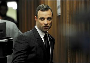 Oscar Pistorius arrives at court in Pretoria, today. His trial continues with evidence being heard from his agent testifying being tried at the double-amputee runner's murder trial surrounding the death of his girlfriend Reeva Steenkamp.  