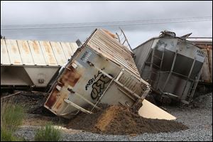 The train was carrying sand that is used in the fracking industry, but the derailed cars contained no hazardous materials.