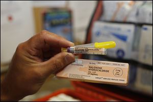 Oregon Fire Department paramedic Greg Pollauf  with Narcan/Naloxone, a drug which can reverse the effects of an opiod overdose.