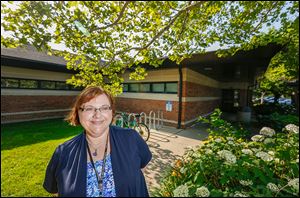 Lisa Green, branch manager at the Oregon Branch Library, says patrons will like the larger, improved library after the renovations. Temporary quarters will be at the old Wynn Elementary School.
