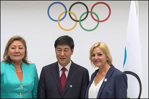 Representatives of the 2022 Olympic Games candidate cities, from left: Amanzholova Zauresh, vice-mayor of Almaty City representing Almaty 2022, Yang Xiaochao, vice-chairman of Beijing 2022, and Eli Grimsby, CEO of the candidate city of Oslo 2022.