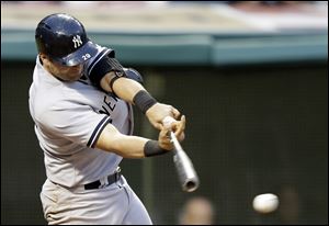 New York Yankees' Francisco Cervelli hits off Cleveland Indians relief pitcher Kyle Crockett in the third inning.