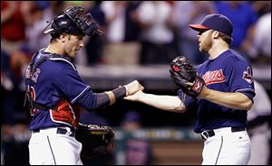 Cleveland Indians relief pitcher Cody Allen, right, is congratulated by catcher Yan Gomes after the Indians defeated the New York Yankees.