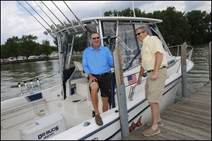 Ohio Governor John Kasich, left, and Jim Zehringer,  Director of the Ohio Department of Natural Resources, return to Port Clinton after a fishing trip on Lake Erie on Wednesday. 