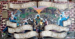 This image, one of the murals at the Youth Visions Reflections Park at Wilson Park in North Toledo, is titled ‘‍From Chaos Comes Clarity.’ It was painted by local artist Edgar Ramirez, and local youths helped come up with the concept. 