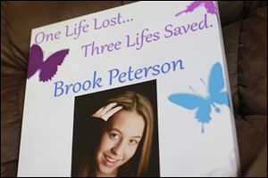 The Petersons will take this sign to the Transplant Games in Houston to honor their daughter, Brook, who was an organ donor. 