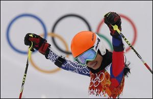 Violinst Vanessa Mae starting under her father name as Vanessa Vanakorn for Thailand celebrates after completing the first run of the women's giant slalom at the Sochi 2014 Winter Olympics in Russia in February.