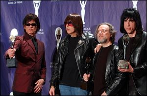 Members of the Ramones, from left to right, Dee Dee, Johnny, Tommy and Marky Ramone hold their awards after being inducted at the Rock and Roll Hall of Fame induction ceremony in this 2002 file photo.
