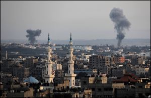 Columns of smoke rise following Israeli strikes on Gaza Strip.