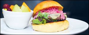 Dill havarti burger with pickled red onions.