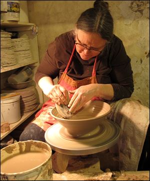 Potter Diana Johnston works in her studio in Mineral Point, Wis. Johnston lives with her husband, Tom, in the malting tower of an old brewery which they have converted into an enormous pottery studio. 