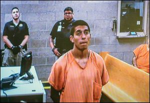 Alex Rios,18, makes an appearance on video for an arraignment in metro court Monday, July 21, 2014 for participating in the beating of two homeless men on the westside in Albuquerque.