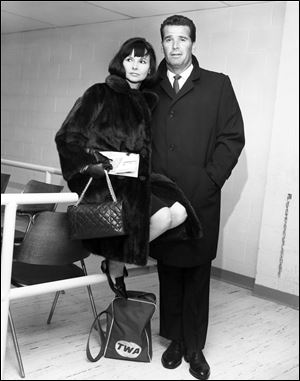 Actor James Garner, right, and his wife Lois are shown in the Trans World Flight Center prior to boarding a TWA Jetliner enroute to London  in this Feb. 21, 1964 file photo taken in New York. 