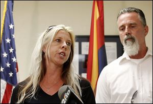 Family members of the victims, Jeanne Brown, left, who had a sister and father murdered, speaks during a news conference as her husband Richard Brown listens, after the nearly two hour long execution of Joseph Rudolph Wood at the state prison on Wednesday.