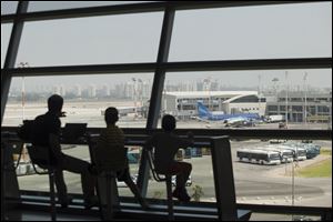 Israelis wait to board at Ben Gurion International airport Wednesday after the U.S. Federal Aviation Administration imposed a restriction on flights Tuesday and Wednesday after a Hamas rocket landed within a mile of the airport, in Tel Aviv, Israel.