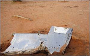 Part of the plane at the crash site in Mali. French soldiers secured a black box from the Air Algerie wreckage site in a desolate region of restive northern Mali today, the French president said. 