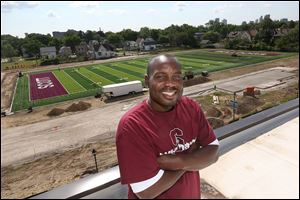 Scott High School football coach Mike Daniels stands atop Scott High School by the continuing construction on its $1.1 million budgeted football field. The Bulldogs play their first home game on the new field August 29, 2014. 