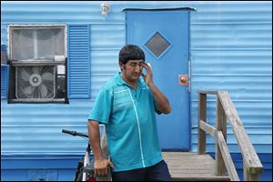 Santiago Garcia, a tobacco worker from Guatemala, pauses as he shares his worry over his inability to work.