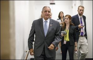 House Veterans Affairs Committee Chairman Jeff Miller (R., Fla.) leaves a Republican caucus meeting on Capitol Hill in Washington on Friday. Rep. Miller and Sen. Bernie Sanders (I., Vt.) scheduled a news conference Monday to talk about a compromise plan to improve veterans’ care.