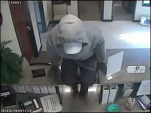 A robber vaults the counter at the Co-Op Toledo Credit Union, 2422 S. Holland-Sylvania Road, after demanding money from the tellers. The suspect was armed with a small silver handgun and took an undisclosed amount of money, police said. He was last seen fleeing the area on foot. There are no injuries reported.