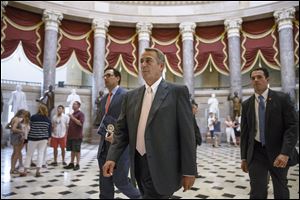 House Speaker John Boehner of Ohio strides to the House chamber  on Capitol Hill in Washington, Wednesday.
