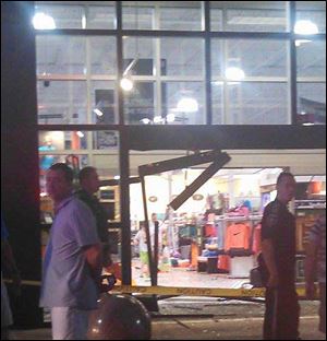 A car crashed through the Dick's Sporting Goods Store in Sandusky, Ohio, Thursday night.