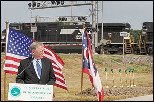 Lucas County Engineer Keith Earley speaks at the groundbreaking for the McCord Road underpass project on Friday in Holland. Construction is expected to be completed in 2016.