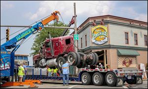 Crews remove the tractor-trailer.