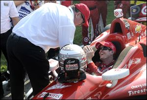 Car owner Chip Ganassi congratulates Scott Dixon, of New Zealand, after Dixon won the Honda Indy 200 at Mid-Ohio Sports Car Course in Lexington, Ohio.